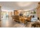 Open-concept living room featuring hardwood floors, a stone fireplace, and lots of natural light at 5848 Kingswood Ct, Norcross, GA 30093