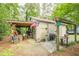 This outbuilding with a covered area is perfect for outdoor activities, projects, and storage at 5848 Kingswood Ct, Norcross, GA 30093