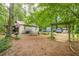 The outdoor space contains a covered area, a storage building, and outdoor recreational space at 5848 Kingswood Ct, Norcross, GA 30093