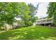 Spacious backyard with play structure and a two-level deck, perfect for outdoor activities at 5868 Kingswood Nw Ct, Norcross, GA 30093