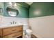 Updated half bathroom with wainscoting and wood vanity at 5868 Kingswood Nw Ct, Norcross, GA 30093