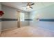 This bedroom features a ceiling fan, window, and playful decor, perfect for a space at 5868 Kingswood Nw Ct, Norcross, GA 30093