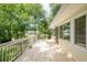 Spacious deck offering outdoor living space and views of the landscaped backyard and surrounding greenery at 5868 Kingswood Nw Ct, Norcross, GA 30093