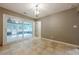 Dining area featuring tile floors and access to an enclosed outdoor space at 5868 Kingswood Nw Ct, Norcross, GA 30093