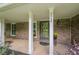 Charming front porch with brick accents and decorative floral arrangements by the door at 5868 Kingswood Nw Ct, Norcross, GA 30093