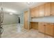 Eat-in kitchen with ample cabinetry and access to additional rooms at 5868 Kingswood Nw Ct, Norcross, GA 30093