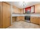 Well-lit kitchen featuring stainless steel appliances and ample cabinetry at 5868 Kingswood Nw Ct, Norcross, GA 30093