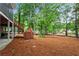 Spacious backyard with a wooden deck and a staircase, perfect for gatherings at 121 Clipper Bay Drive, Alpharetta, GA 30005