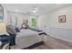 A comfy bedroom with neutral walls, a ceiling fan, and two windows that allow plenty of natural light at 121 Clipper Bay Drive, Alpharetta, GA 30005