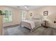 This comfortable bedroom has neutral-colored walls, shutters, and hardwood floors at 121 Clipper Bay Drive, Alpharetta, GA 30005