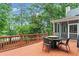 This wooden deck has ample seating and overlooks a lush, green backyard at 121 Clipper Bay Drive, Alpharetta, GA 30005