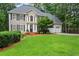 Charming two-story home with manicured lawn, attached two-car garage, and basketball hoop at 121 Clipper Bay Drive, Alpharetta, GA 30005
