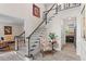 Grand foyer with staircase, wood floors, and views into the living room and kitchen at 121 Clipper Bay Drive, Alpharetta, GA 30005