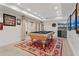 Basement game room with a pool table and a wet bar for entertaining guests at 121 Clipper Bay Drive, Alpharetta, GA 30005