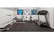 Home gym with weight training equipment and a treadmill for convenient workouts at 121 Clipper Bay Drive, Alpharetta, GA 30005