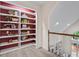 Hallway with built-in shelving and stair access at 121 Clipper Bay Drive, Alpharetta, GA 30005
