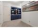 Inviting hallway with stylish built-in shelving and sports memorabilia display at 121 Clipper Bay Drive, Alpharetta, GA 30005