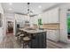 Bright kitchen features a gray island with granite countertops and stainless steel appliances at 121 Clipper Bay Drive, Alpharetta, GA 30005