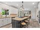 Open kitchen with island, granite countertops, breakfast bar, and stainless steel appliances at 121 Clipper Bay Drive, Alpharetta, GA 30005