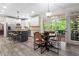 Kitchen with a breakfast table and view to the outside deck at 121 Clipper Bay Drive, Alpharetta, GA 30005
