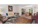 Cozy living room with decorative rug, ornate glass coffee table, and access to dining room at 121 Clipper Bay Drive, Alpharetta, GA 30005