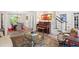Inviting living room with piano, decorative rug, and access to dining area at 121 Clipper Bay Drive, Alpharetta, GA 30005