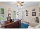 Bright home office featuring plantation shutters, crown molding, and wainscoting at 121 Clipper Bay Drive, Alpharetta, GA 30005