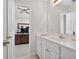 Bright bathroom featuring a white vanity, large mirror, and neutral color scheme at 1232 Everton Pl, Cumming, GA 30041