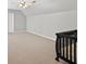 Spacious room featuring plush carpeting and a modern ceiling fan at 1232 Everton Pl, Cumming, GA 30041