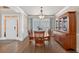 Dining room with hardwood floors, large window, and classic furnishings at 1232 Everton Pl, Cumming, GA 30041