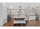 Spacious kitchen featuring a large center island, stainless steel appliances, and hardwood floors at 1232 Everton Pl, Cumming, GA 30041