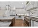 Stylish kitchen with white cabinets, stainless steel appliances, and a pot filler faucet at 1232 Everton Pl, Cumming, GA 30041