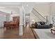 Open concept living space with hardwood floors and a staircase at 1232 Everton Pl, Cumming, GA 30041