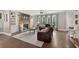 Bright living room with a fireplace, built-ins, and hardwood floors that flow seamlessly at 1232 Everton Pl, Cumming, GA 30041