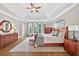 Cozy main bedroom with hardwood floors, tray ceilings, and abundant natural light at 1232 Everton Pl, Cumming, GA 30041