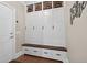 Functional mudroom with custom built-in storage lockers, bench seating, and coat hooks at 1232 Everton Pl, Cumming, GA 30041