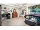 A cute and cozy bedroom featuring a nice tapestry, decorative mirror, and a ceiling fan for comfortable living at 1250 Timber Walk Dr, Loganville, GA 30052