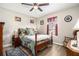 Cozy bedroom with a comfortable bed, complemented by a traditional rocking chair at 1250 Timber Walk Dr, Loganville, GA 30052