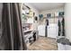 Functional laundry room with ample shelving, storage, washer, and dryer hookups at 1250 Timber Walk Dr, Loganville, GA 30052