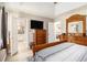 Spacious bedroom with attached bath and walk in closet, trey ceiling, and view to other rooms at 1250 Timber Walk Dr, Loganville, GA 30052