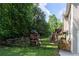 Fenced backyard with playset and access to a wooden deck with stairs at 19 Autumn Ne Pl, White, GA 30184