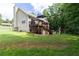 Well-maintained backyard with a deck, play area, and fenced perimeter at 19 Autumn Ne Pl, White, GA 30184