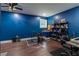 Basement featuring blue walls, hardwood floors, and an electronic drum set at 19 Autumn Ne Pl, White, GA 30184