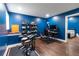 Basement featuring blue walls, hardwood floors, an electronic drum set, and a keyboard at 19 Autumn Ne Pl, White, GA 30184