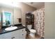 Traditional bathroom featuring a vanity with a black countertop and neutral earth tone walls at 19 Autumn Ne Pl, White, GA 30184
