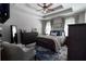 Comfortable bedroom featuring tray ceilings, carpet, and a large bed with decorative pillows at 19 Autumn Ne Pl, White, GA 30184
