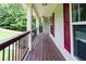 Covered front porch featuring stained wood, white columns, and space for plants to create a warm welcome at 19 Autumn Ne Pl, White, GA 30184