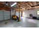 Spacious garage with multiple bays, bare insulation, and room for vehicle parking and storage at 19 Autumn Ne Pl, White, GA 30184