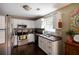 Bright kitchen with white cabinetry, stainless steel appliances, and a view from the window at 19 Autumn Ne Pl, White, GA 30184