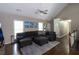 Spacious living room featuring hardwood floors, a large sectional, and plenty of natural light at 19 Autumn Ne Pl, White, GA 30184